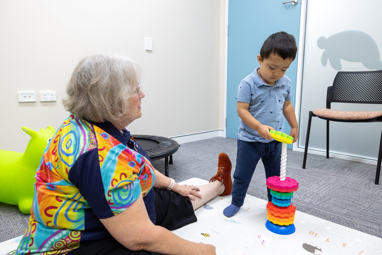 Clinician and child in therapy session