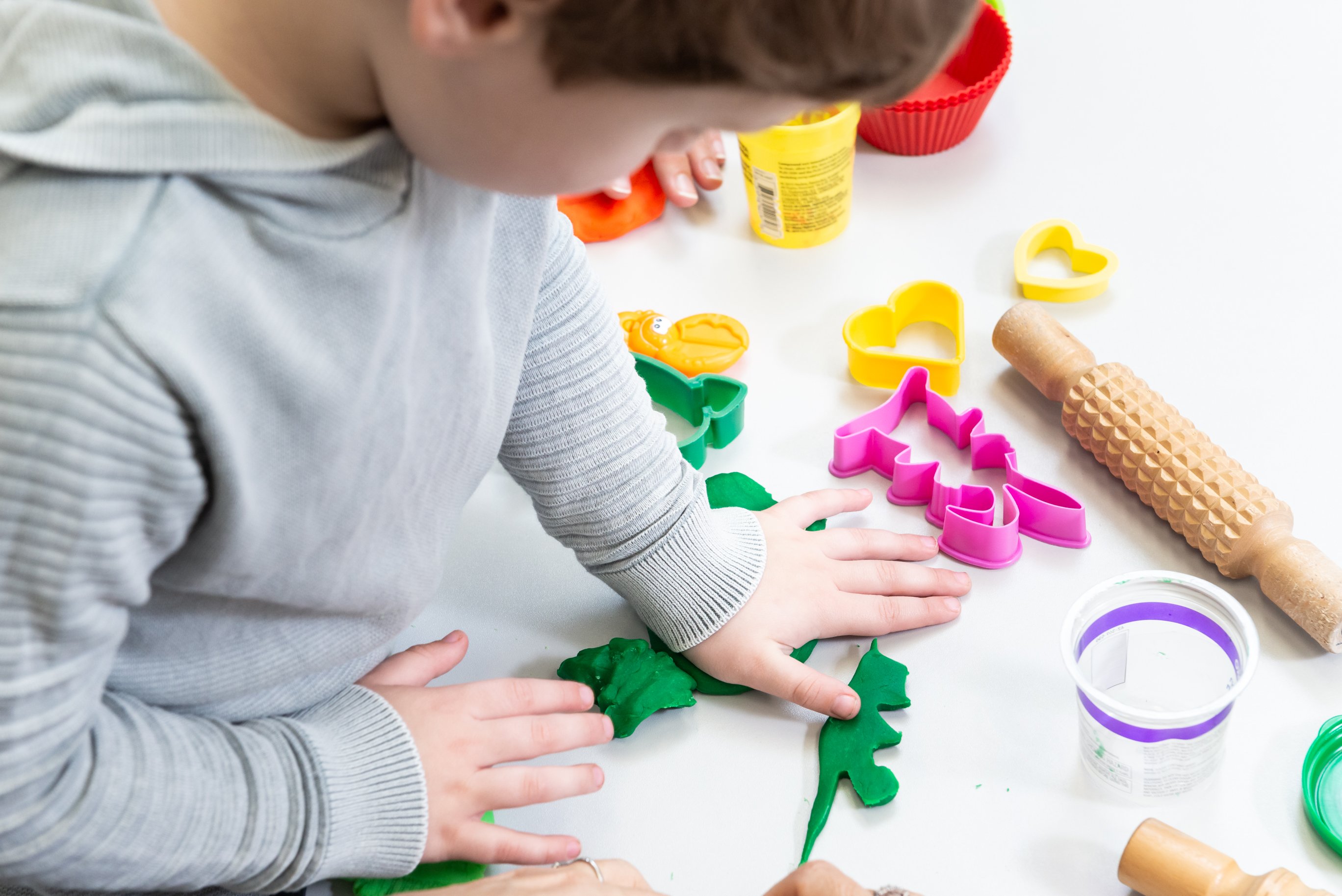 Child playing with Play Doh